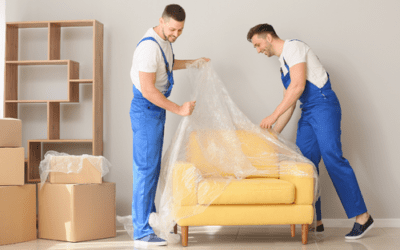 Covering floors and furniture with tarpaulins before painting the house